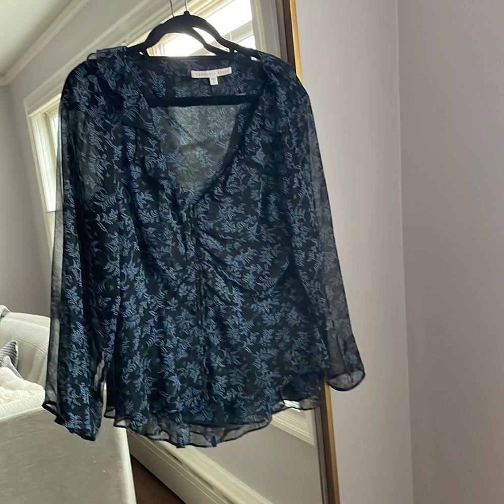 100 %silk ruffle front blouse with button closure